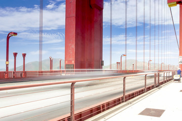 Blurred Trails of Cars and People Passing By on The Golden Gate