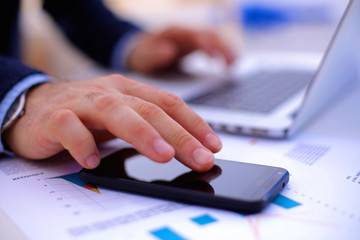 businessman working at a computer hands closeup