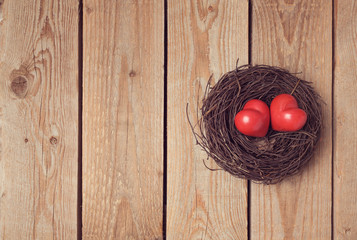 Valentine's day concept with couple of hearts in bird nest. View from above