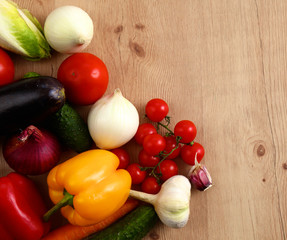 Composition with assorted raw organic vegetables wooden table