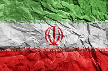 Iran flag painted on crumpled paper background