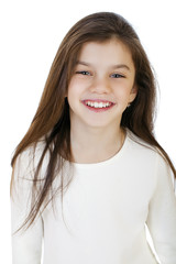 Portrait of a charming little girl smiling at camera