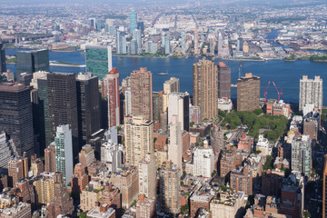 Panoramic view of Manhattan, East River and Queens as seen from the Empire State Building observation deck (New York, USA)