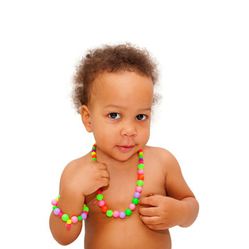 Black baby wearing a beads