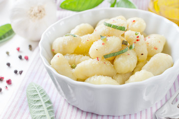 Italian gnocchi with sage leaves and olive oil