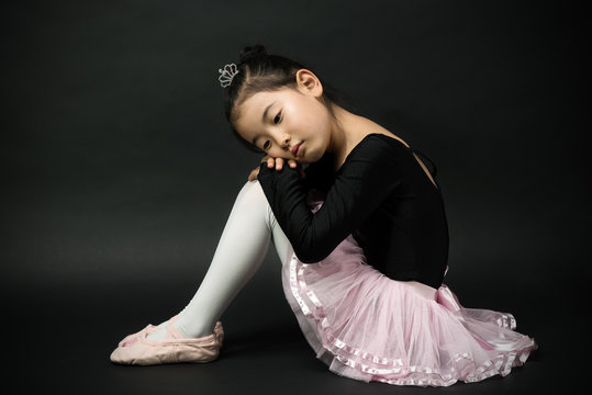 Aspiring Ballerina Wearing Black Ballet Costume Asian Kid