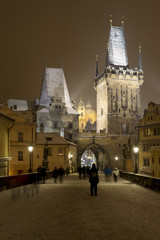 Obraz premium Night romantic snowy Prague Lesser Town from Charles Bridge, Czech republic