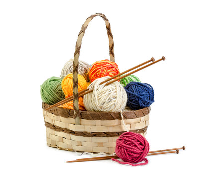 Wicker basket with balls of yarn