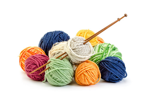 Colorful balls of yarn and wooden needles