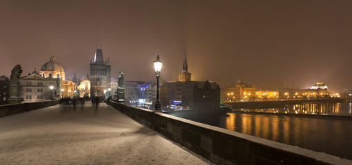 Fototapeta premium Night romantic snowy Prague Old Town from Charles Bridge, Czech republic