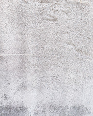 Worn grey cement stone wall