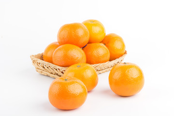 Orange ripe in basket on white background.