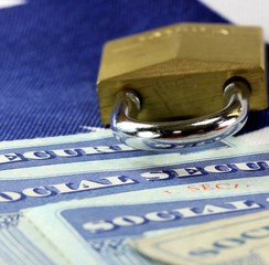 Padlock and social security card - Identity theft and identity protection concept