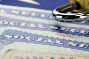 Padlock and social security card - Identity theft and identity protection concept