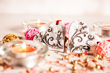 Holidays, a gift and a heart on a wooden background / valentine's day background