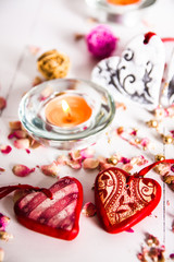 Naklejka na ściany i meble Holidays, a gift and a heart on a wooden background / valentine's day background
