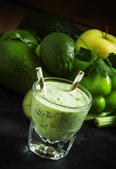Green detox smoothie with avocado, kiwi, celery, bell peppers