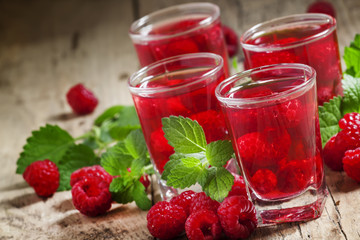 Refreshing raspberry drink with berries and mint, selective focu