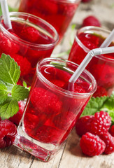 Refreshing raspberry drink with berries and mint, selective focu