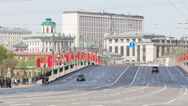 Large stone bridge with red flags