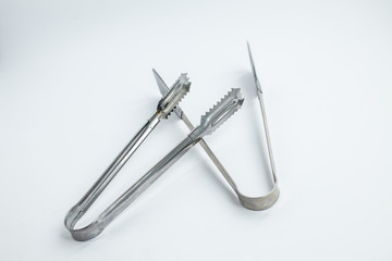 two ice tong on the white background 
