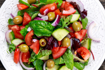 Fresh raw Vegetable mixed salad. close up view from top.