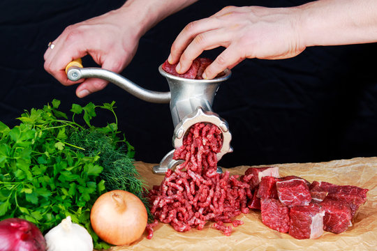 Freshly ground meat coming out of a meat grinder - Stock Image - F017/6580  - Science Photo Library