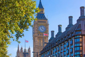 Fototapeta na wymiar The Union Flag flying in front of the clock tower Big Ben, Palace of Westminster. London UK