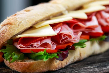 Door stickers Snack Sandwich with lettuce, slices of fresh tomatoes, salami, hum and cheese.