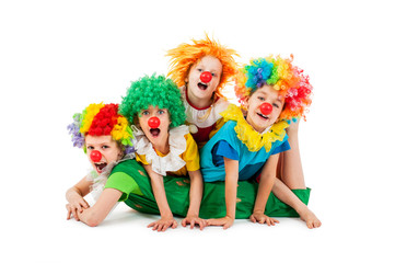 Happy children at the party in clowns costume