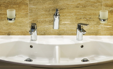 Closeup of water-supply faucet in modern bathroom