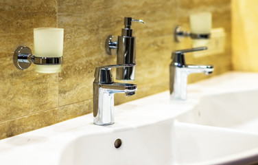 Closeup of water-supply faucet in modern bathroom