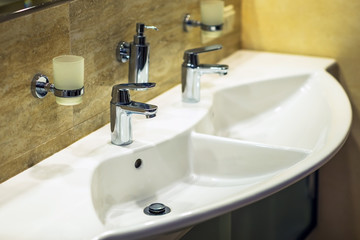Closeup of water-supply faucet in modern bathroom