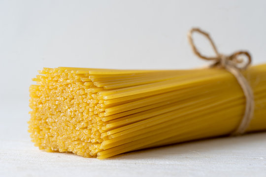 Detial view of spaghetti pasta on kitchen table. Selective focus.