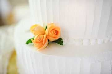 wedding cake decorated with roses