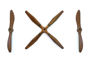 Wooden plane propellers with 4 and 2 blades isolated on white background.