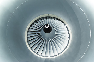 Close up and detailed view of airplane engine turbine blades.