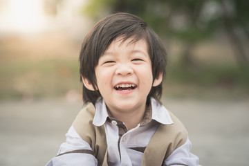 Close up portrait of boy laughing.. © lalalululala