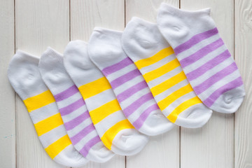 colorful striped socks on a white background