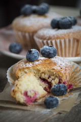 Homemade blueberry muffin with berries for a snack
