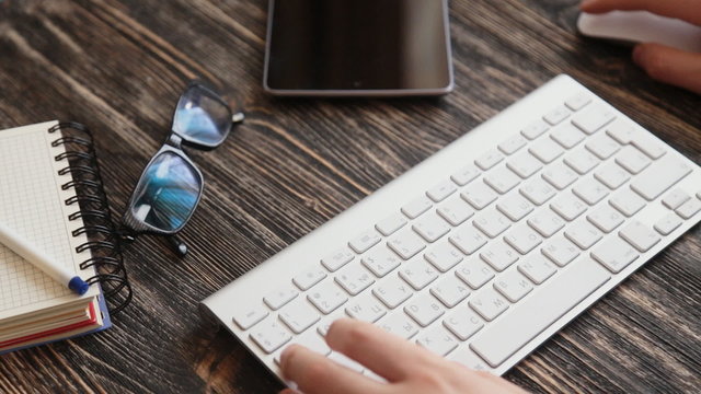 Workplace  glasses and note paper on wooden table