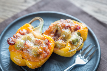 Stuffed peppers with sausages and mozzarella topping