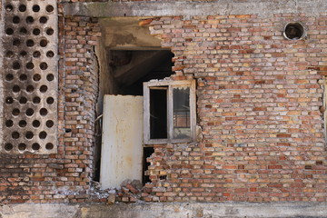 Old destroyed window on brick wall in Sarajevo , Bosnia and Herzegovina