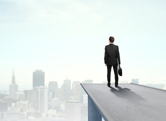 businessman standing on pier