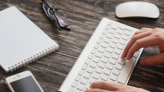 Workplace  glasses and note paper on wooden table