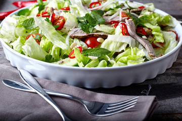 Asian beef salad with cucumber, lettuce and chilli