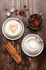 Coffee cappuccino cup on wooden table. Top view
