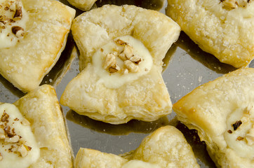 Cakes of puff pastry with custard and walnuts