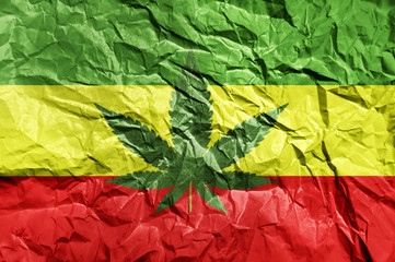 Rasta flag painted on crumpled paper background