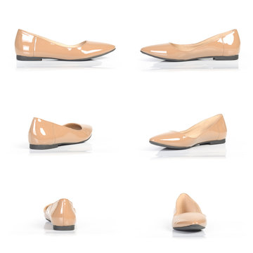beige ballet flats isolated on white